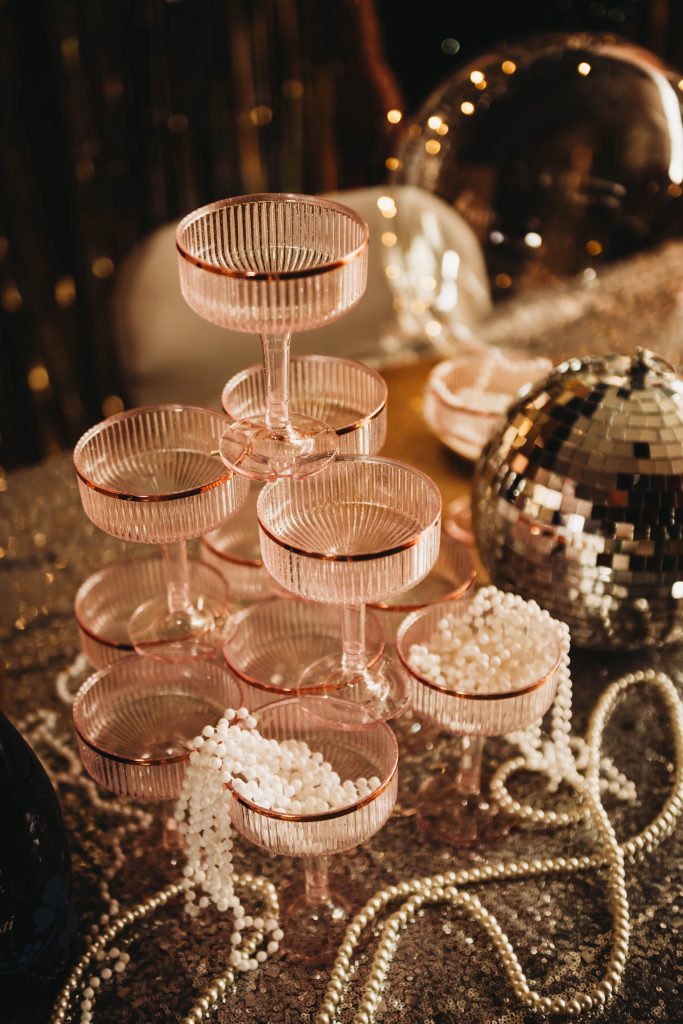 Luxury boudoir experience in Northwest Ohio featuring champagne glasses and pearls at Boudoir by Amy Gilmore studio.